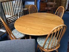 An Ercol Golden Dawn dining table and four hoop back chairs