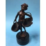 A small bronze of a boy holding two baskets, 29cm height