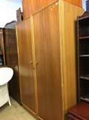 A Meredew teak double door wardrobe etc.