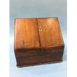 A walnut stationary box with fold out sides