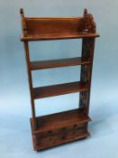 A small reproduction mahogany shelf