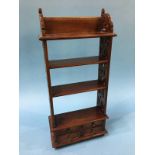 A small reproduction mahogany shelf