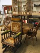 An Ercol table, four chairs and an American rocking chair