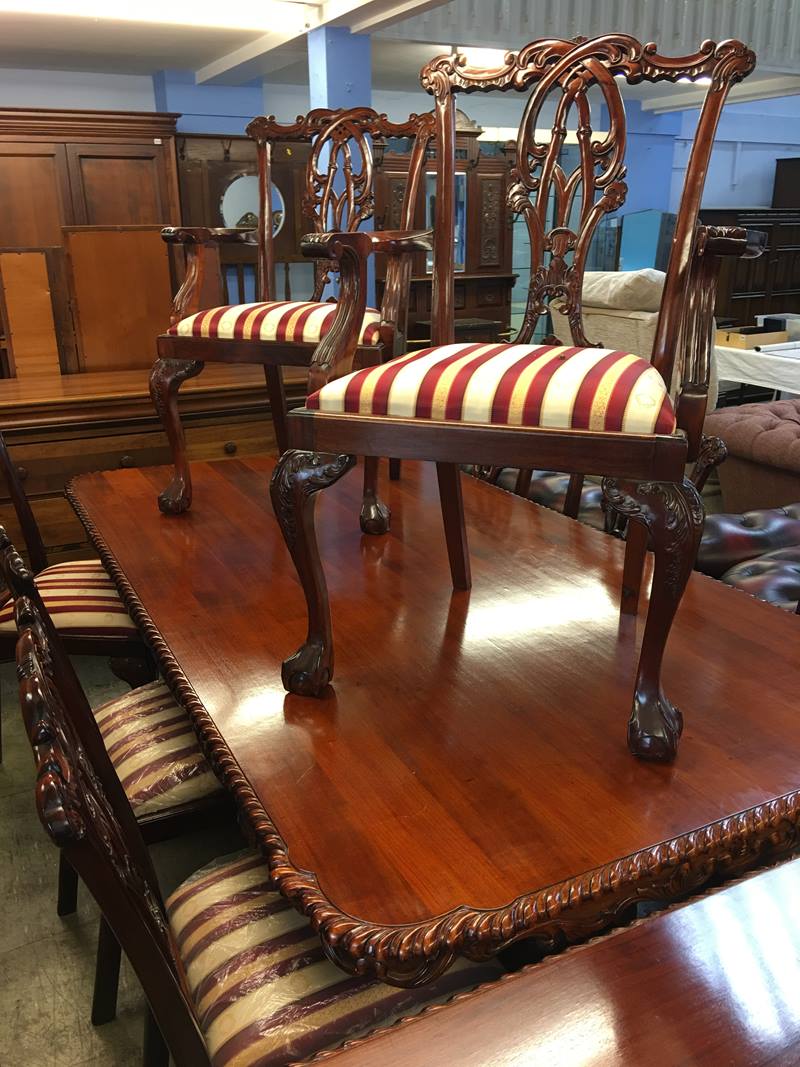 A reproduction rectangular top table with a set of eight chairs, comprising six single and two