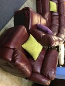 A large burgundy leather corner suite