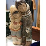 Lladro figure group of two Eskimos with arms around each other. Height 33 cm
