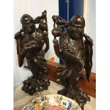 Pair of Oriental Rootmen figures