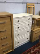 Three modern chest of drawers and a chair