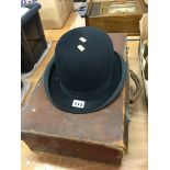 A Bowler hat and a suitcase