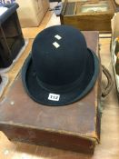 A Bowler hat and a suitcase