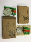Two boxed World War II Defence medals, un-named