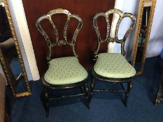 A pair of Victorian ebonised and mother of pearl inlaid cane work chairs