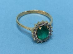 An 18ct emerald and diamond ring, size 'S', 3.3g