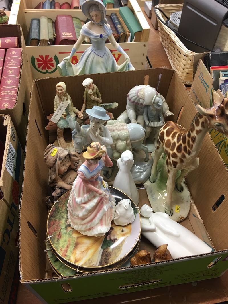 One box of decorative figures and plates