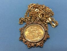 A Sovereign, dated 1918 in 9ct gold mount, 13g