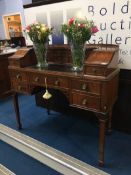 A reproduction mahogany Carlton House desk