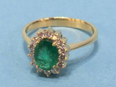 An 18ct emerald and diamond ring, size 'S', 3.3g