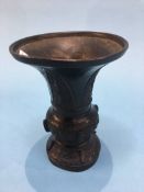 A bronze Oriental flared Gu vase