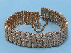 A 9ct yellow and white gold diamond bracelet, approx. 3 carats of diamonds, 30g