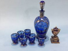 A seven piece liquor set, together with a small vase