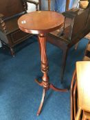 A reproduction mahogany pedestal