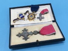 A boxed MBE medal together with two 9ct badges to the Mayor and Mayoress of Hartlepool