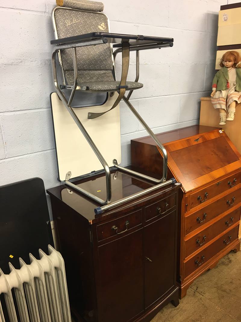 Walnut bow front cabinet and a highchair