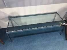 A Merrow chrome and glass inset top coffee table, 114 x 46cm