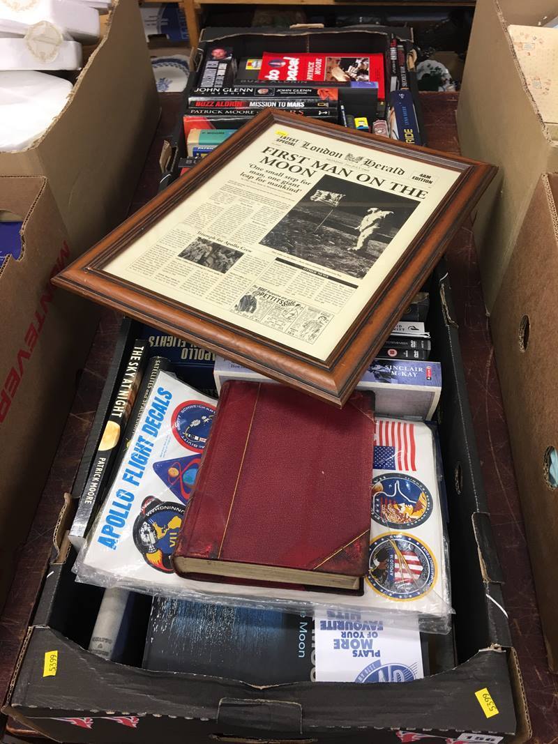 Two boxes of books; space/astronaut topics, including a framed 'First Man on the Moon' newspaper