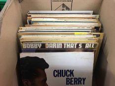 A box of vinyl records, Chuck Berry, Bobby Darrin etc.