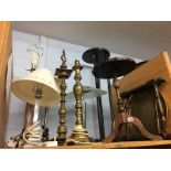 Brass folding table and a shelf of lamps
