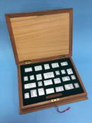 Cased set of silver replica stamps, 485g