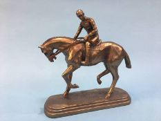 A resin figure of a Horse and Jockey