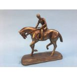 A resin figure of a Horse and Jockey