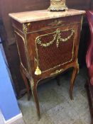 A Louis XV style marble top side cabinet