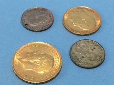 A full Sovereign, a half Sovereign and two other coins