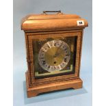 An oak mantle clock