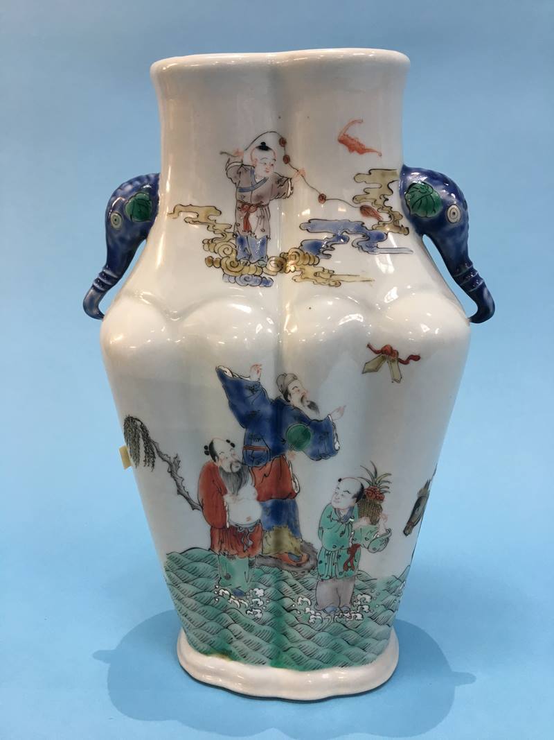An Oriental vase, decorated with figures and elephant heads, six character mark to base 28cm high No