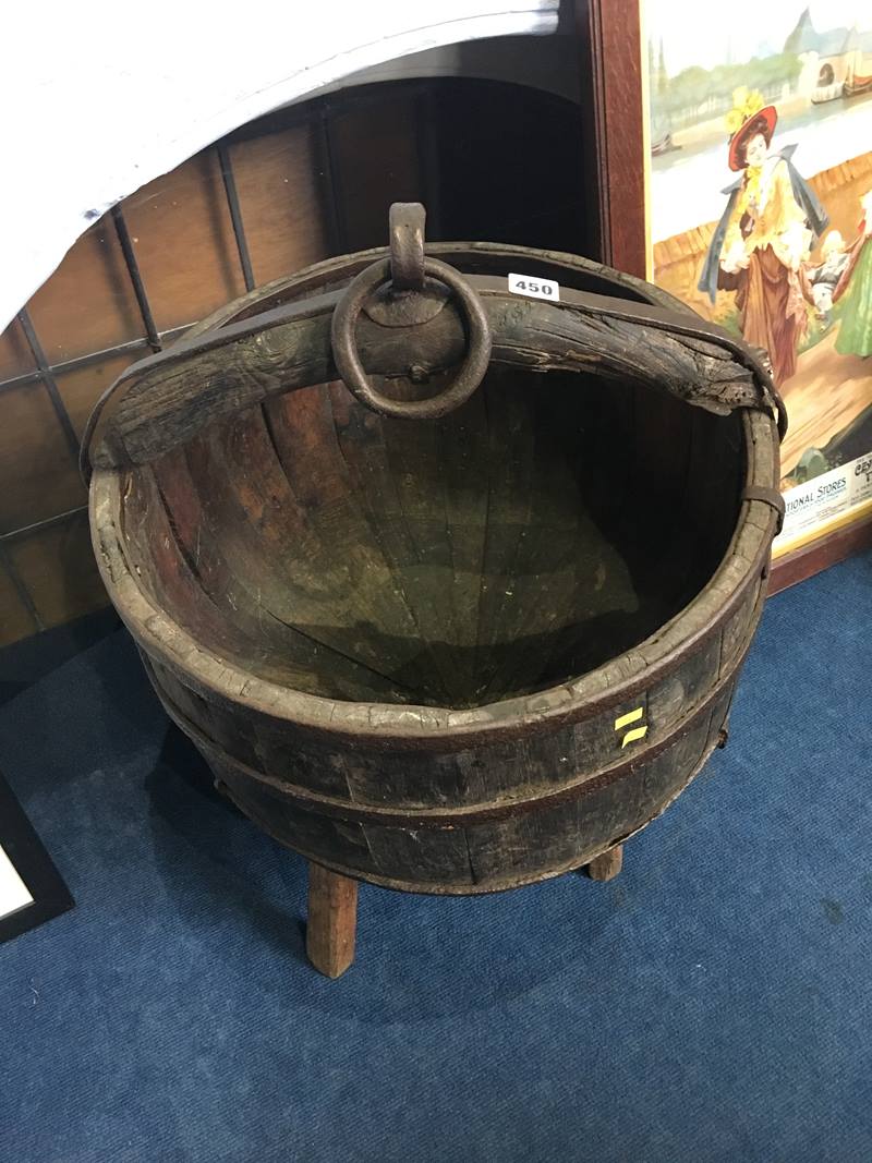 A Chinese well bucket with three iron straps and a stand