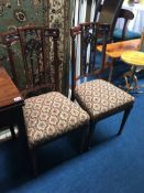 A pair of Edwardian mahogany single chairs