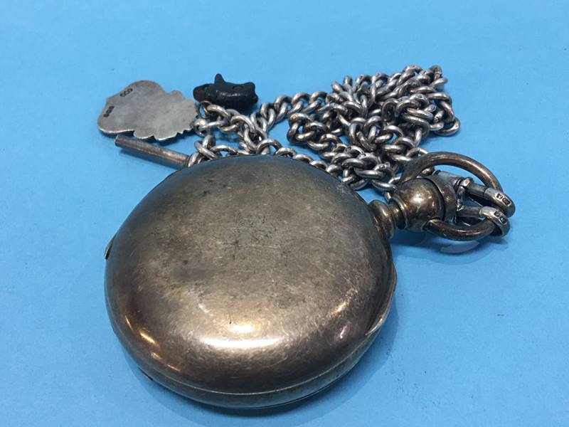 A Waltham pocket watch with silver Albert