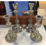 Two pairs of plated candlesticks