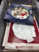 Box of commemorative and Christmas plates