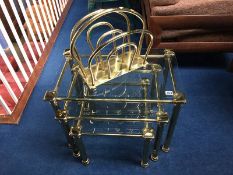 Brass and glass nest of tables and a magazine rack