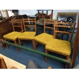 A set of four teak chairs