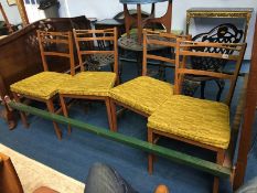 A set of four teak chairs