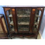 An Edwardian mahogany Art Nouveau china cabinet