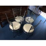 Circular tables and four chairs