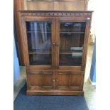 An Ercol oak display cabinet