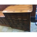 An Ercol two door cabinet